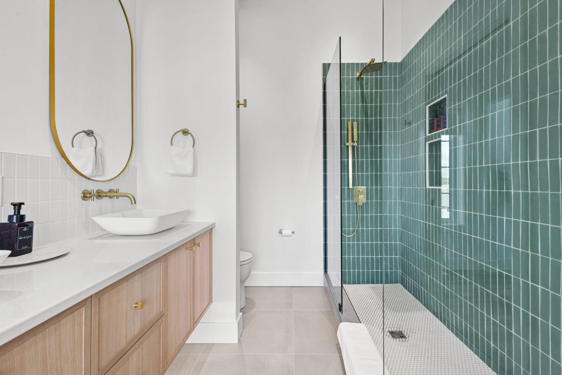 Custom walk-in tiled shower in a primary suite
